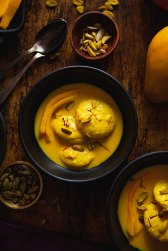 Soft cheese patties dipped in sweetened kesar milk