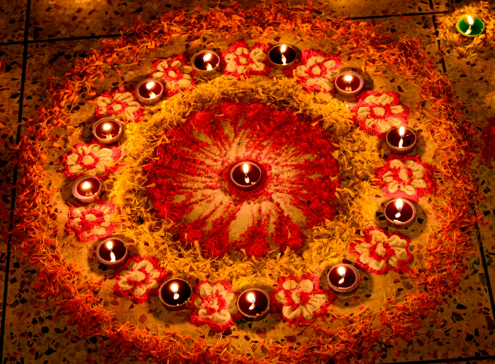 Floral rangoli with a diya