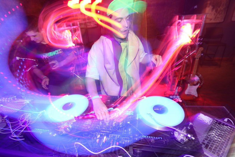 A DJ playing music - Top 10 Party Spots In Goa