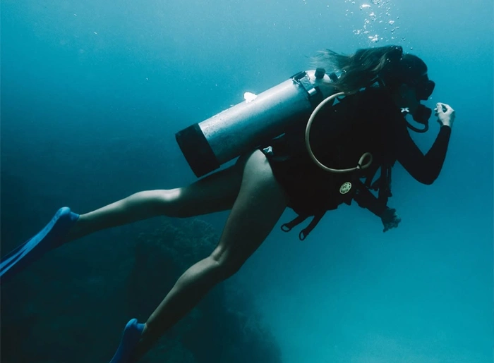 A woman diving underwater