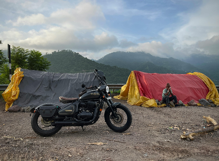 A motorbike near two tents